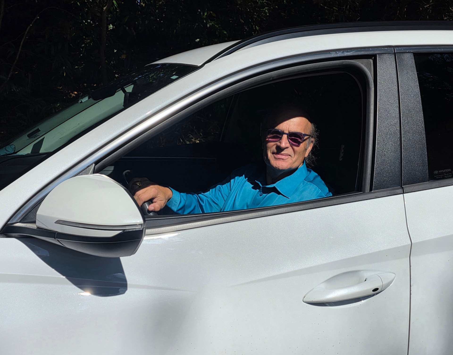 Michael Alexander at the wheel of his car