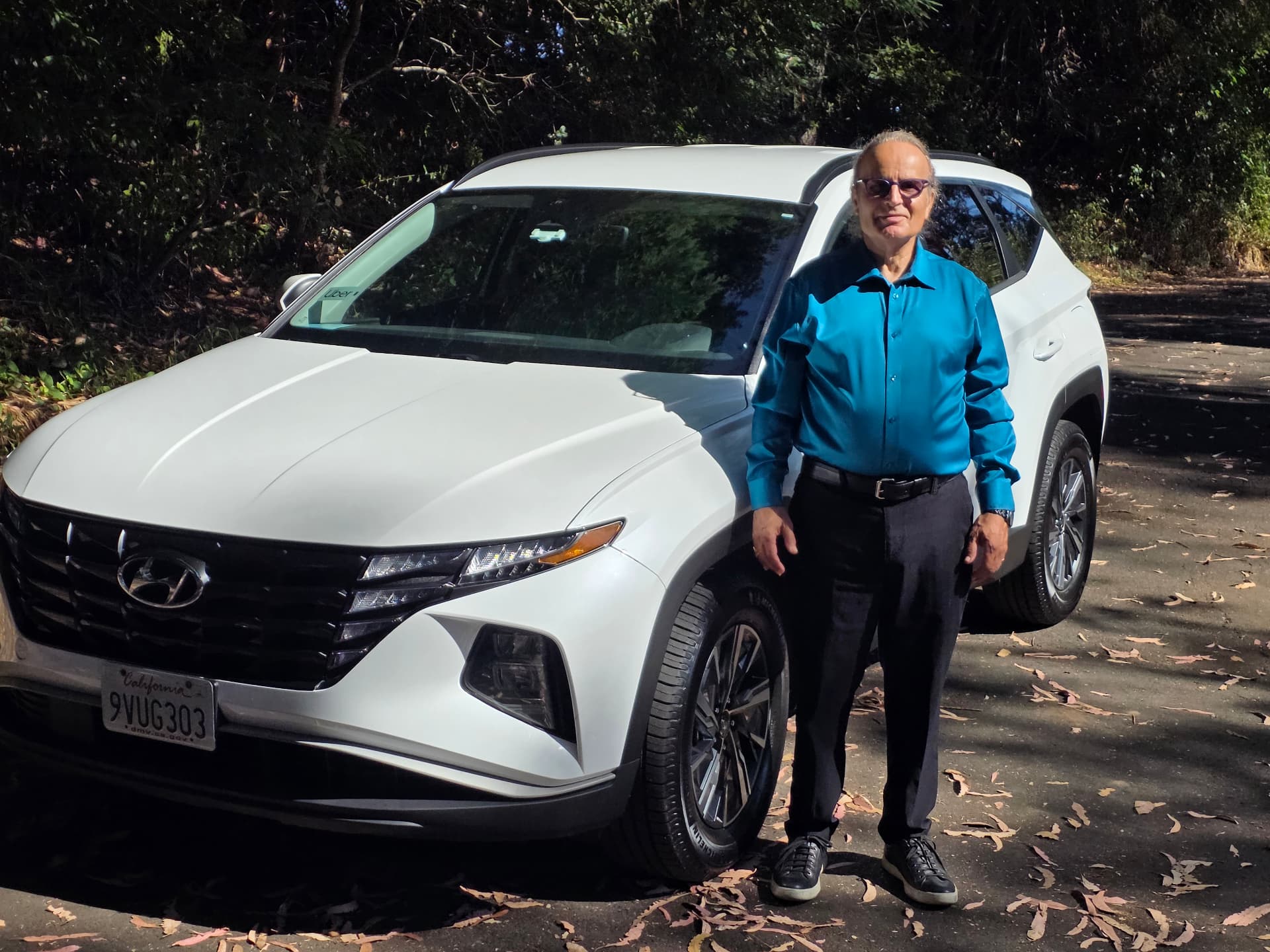 Michael Alexander standing beside his car in daylight
